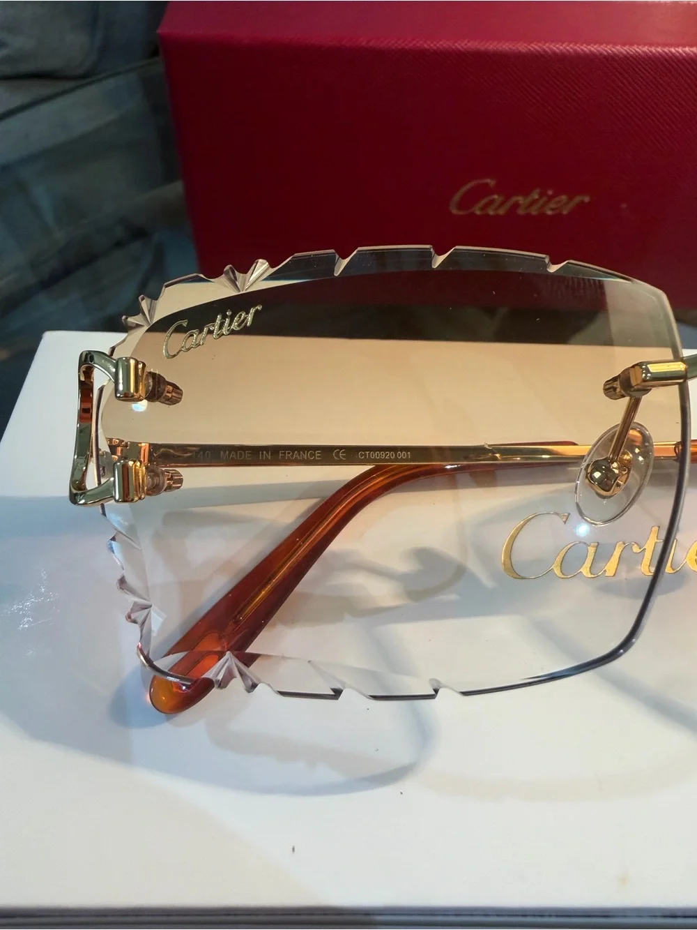 Cartier Men's Rimless Sunglasses with Purple Lenses and Gold Bridge